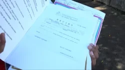Capital city families receive property deeds and legal security for their homes