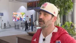 “I wear that flag with pride”: Baumgartner sets off for fifth Olympic games
