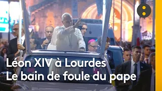 Pope Leo XIV in Lourdes: The Pope greets the faithful from the Popemobile on his way to the sanct...