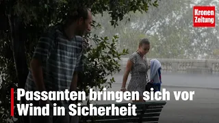 Pedestrians take cover from high winds | krone.tv NEWS