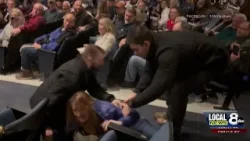 Woman is forcefully removed from town hall meeting