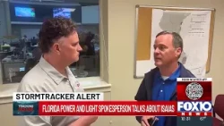 Brendan Kirby talks with Florida Power and Light's David Peaden about restoring service after Isa...