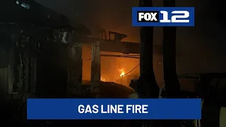 Crews battle house fire involving active gas line in SE Portland