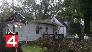Volunteers help remove tree on family's home on Detroit's west side