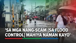 Hagonoy residents condemn flood control corruption while wading through flood | ABS-CBN News