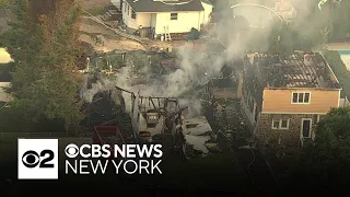 Massive fire levels home, spreads to another in New Jersey