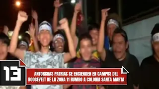 Patriotic torches are lit at Roosevelt fields in Zone 11 heading toward Santa Marta neighborhood