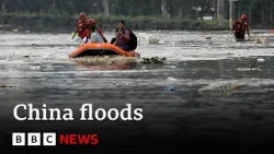 China floods: Heavy flooding sees tens of thousands evacuated | BBC News