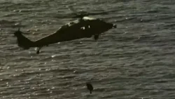 Astronauts hoisted by helicopter from splashdown site