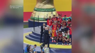 FIFA president appears to usher President Trump away as Spain lifts trophy