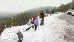 Low-level snow lures visitors to Oakhurst as Highway 41 closes north of town