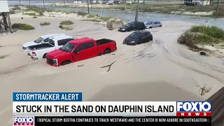 Multiple vehicles trapped in sand as flooding hits Dauphin Island
