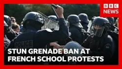 Stun grenades banned in French student protests after teenager's hand blown off | BBC News