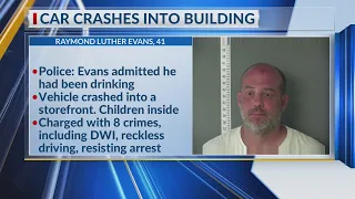 Police: Man crashes into building intoxicated, children present