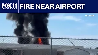 Towering flames, smoke from warehouse near Fullerton airport