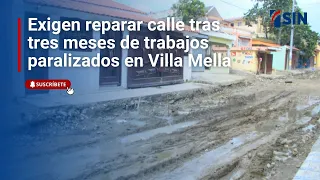 Residents demand street repairs after three months of stalled work in Villa Mella