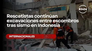 Rescue workers continue digging through rubble after earthquake in Indonesia