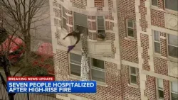 People dangle out of homes awaiting rescue from South Shore high rise fire