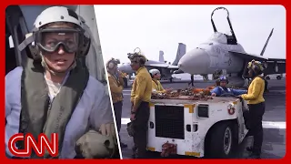 Aboard a warship Trump says was attacked 100+ times since Iran war