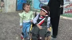 A young girl pushes her disabled brother to school every day
