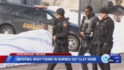 Police find body in burned out Clay home after manhunt