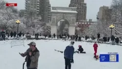 NY residents having fun at a snowball fight during blizzard NY residents having fun at a snowball fight during blizzard