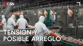 GRANJA TRES ARROYOS: Workers allow trucks to enter